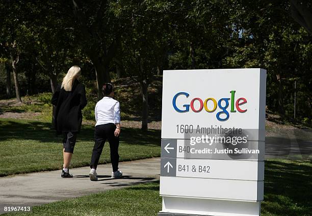 Pedestrians walk by a sign outside of the Google headquarters July 17, 2008 in Mountain View, California. Google Inc. Is expected to announce an...