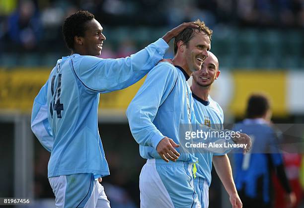 Dietemar Hamann of Manchester City celebrates with Jo Silva and Stephen Ireland after scoring the second goal during the UEFA Cup 1st Round 1st Leg...
