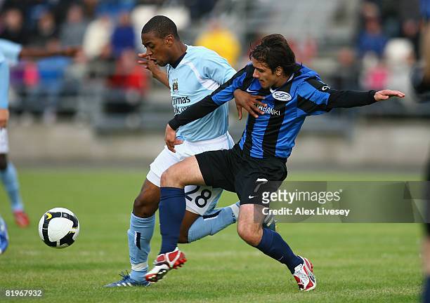 Gelson Fernandes of Manchester City is tackled by Levi Hanssen of EB/Streymur during the UEFA Cup 1st Round 1st Leg Qualifying match between...
