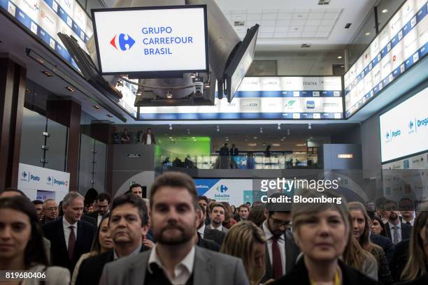 Monitor displays Grupo Carrefour Brasil signage during the initial public offering of Atacadao SA, the Brazilian unit of French retailer Carrefour...