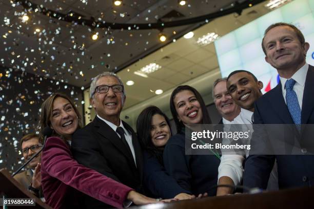 Billionaire Abilio Diniz, second left, and Charles Desmartis, chief executive officer of Grupo Carrefour Brasil, right, ring the opening bell during...