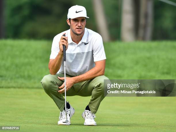 Andrew Buchanan of the United States lines up his putt on the fourth hole during round one of the Mackenzie Investments Open held at Club de Golf Les...