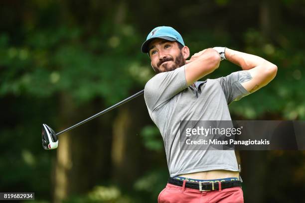 Raoul Menard of Canada tees off from the tenth hole during round one of the Mackenzie Investments Open held at Club de Golf Les Quatre Domaines on...