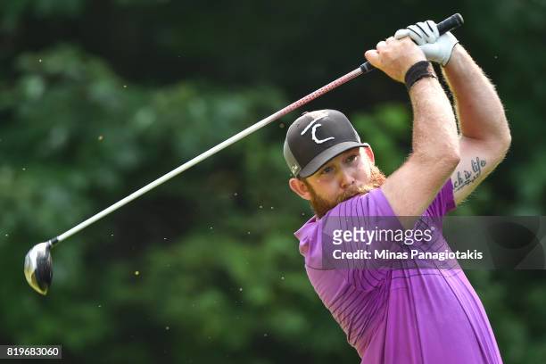 Andrew Ledger of Canada tees off from the fifth hole during round one of the Mackenzie Investments Open held at Club de Golf Les Quatre Domaines on...