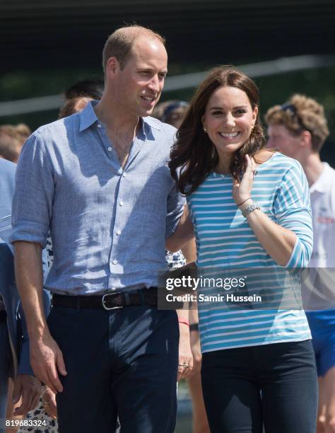 Prince William, Duke of Cambridge and Catherine, Duchess of Cambridge walk together after participating in a rowing race between the twinned town of...