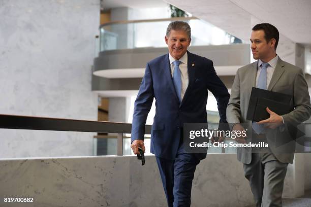 Senate Intellignece Committee member Sen. Joe Manchin arrives for a closed door session in the Hart Senate Office Building on Capitol Hill July 20,...