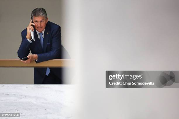 Senate Intellignece Committee member Sen. Joe Manchin steps out of the committee's secure meeting space to talk on the phone in the Hart Senate...