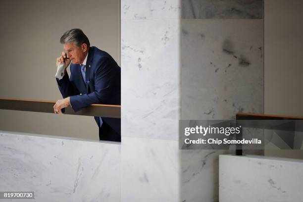 Senate Intellignece Committee member Sen. Joe Manchin steps out of the committee's secure meeting space to talk on the phone in the Hart Senate...