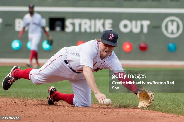 Brock Holt of the Boston Red Sox makes a diving stop against the Toronto Blue Jays in the third inning at Fenway Park on July 20, 2017 in Boston,...