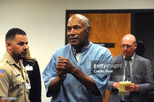 Simpson reacts after learning he was granted parole at Lovelock Correctional Center July 20, 2017 in Lovelock, Nevada. Simpson is serving a nine to...