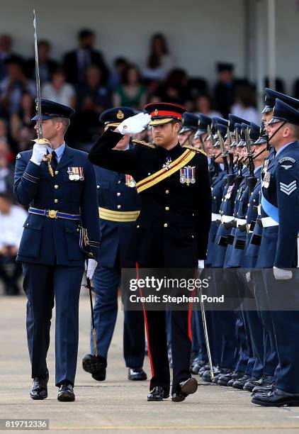 Prince Harry inspects a parade as he presents the Royal Air Force Regiment with a new Colour to commemorate their 75th anniversary during an official...