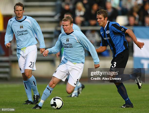 Michael Ball of Manchester City beats Peter Foldgast of EB/Streymur during the UEFA Cup 1st Round 1st Leg Qualifying match between EB/Streymur and...