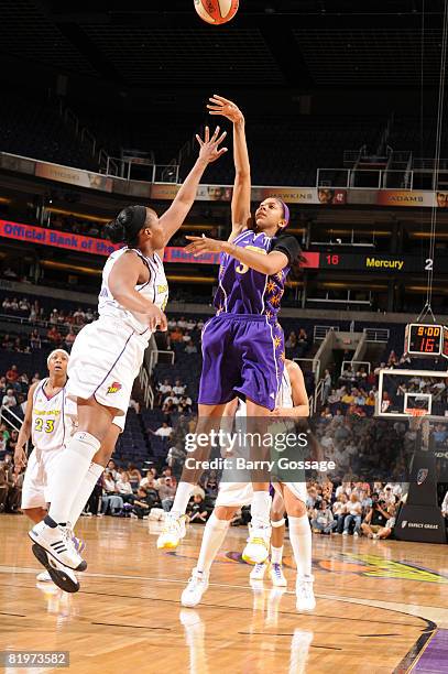 Candace Parker of the Los Angeles Sparks shoots against Le'coe Willingham of the Phoenix Mercury on July 17 at U.S. Airways Center in Phoenix,...