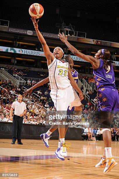 Cappie Pondexter of the Phoenix Mercury shoots against Lisa Leslie of the Los Angeles Sparks on July 17 at U.S. Airways Center in Phoenix, Arizona....