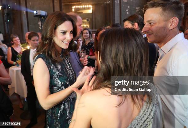 Catherine, Duchess of Cambridge , chats with German actress Jana Pallaske and actor Thomas Wlaschiha at a reception at Claerchen's Ballhaus dance...