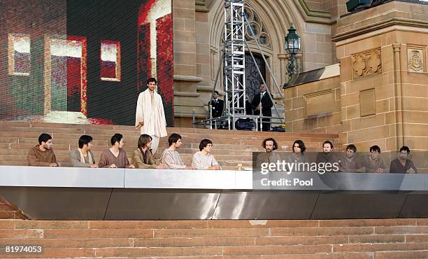 An actor playing Jesus arrives at the last supper during the The Stations of the Cross outside St Mary's Cathedral in Sydney, Friday, July 18,...