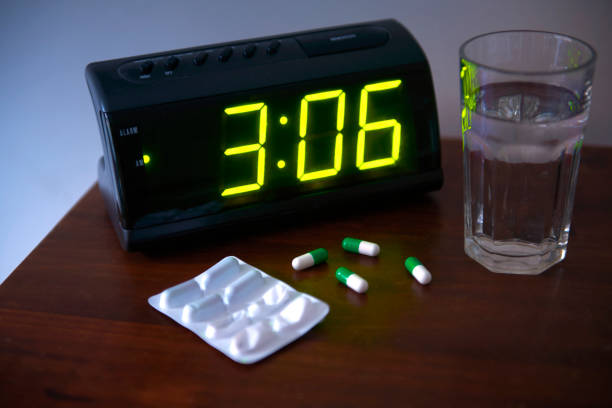 sleeping pills in bedroom - 睡眠不足 ストックフォトと画像