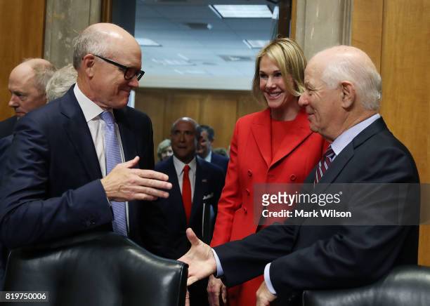 Robert Wood Johnson IV and Kelly Knight Craft talk with Sen. Ben Cardin before their Senate Foreign Relations Committee confirmation hearing on...
