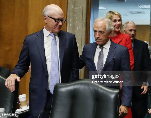 Robert Wood Johnson IV stands with Chairman Bob Corker before Johnson's confirmation hearing to be ambassador to the United Kingdom, during a Senate...