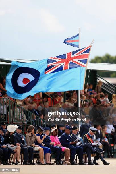 Guests look on as members of the Royal Air Force Regiment parade during an official visit to RAF Honington at RAF Honington on July 20, 2017 in Bury...