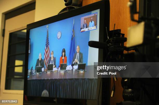 The parole board is seen on a television as O.J. Simpson attends his parole hearing at Lovelock Correctional Center July 20, 2017 in Lovelock,...