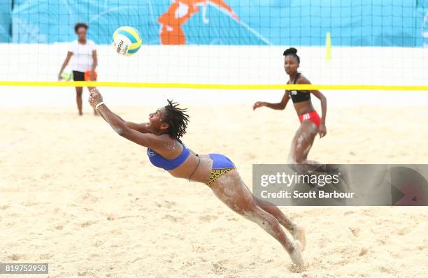 Tsyan Selvon and Ebony Williams of Trinidad And Tobago compete against Rose Mary Moise and Luduine Tebeim of Vanuatu during the Trinidad And Tobago...
