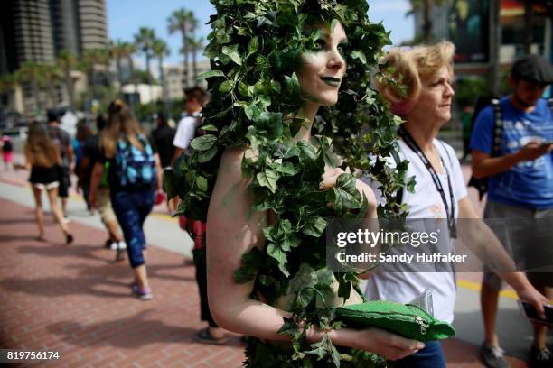 Visitors dressed in Cosplay costumes walk along the San Diego Convention Center during Comic Con International on July 20, 2017 in San Diego,...