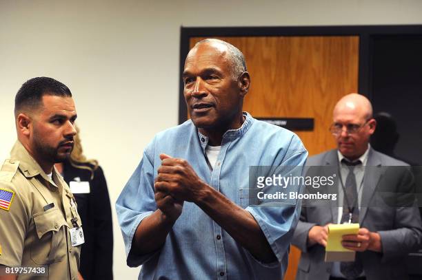 Former professional football player O.J. Simpson speaks while leaving after a parole hearing at Lovelock Correctional Center in Lovelock, Nevada,...