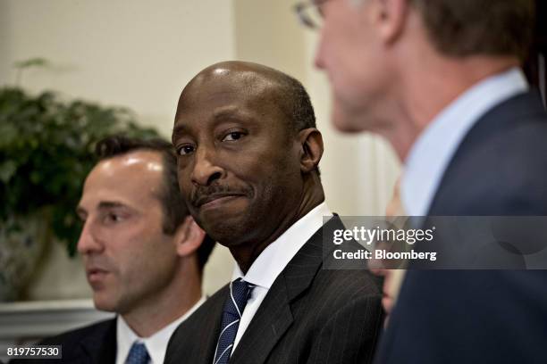 Ken Frazier, chairman and chief executive officer of Merck & Co., listens during an announcement on a new pharmaceutical glass packaging initiative...