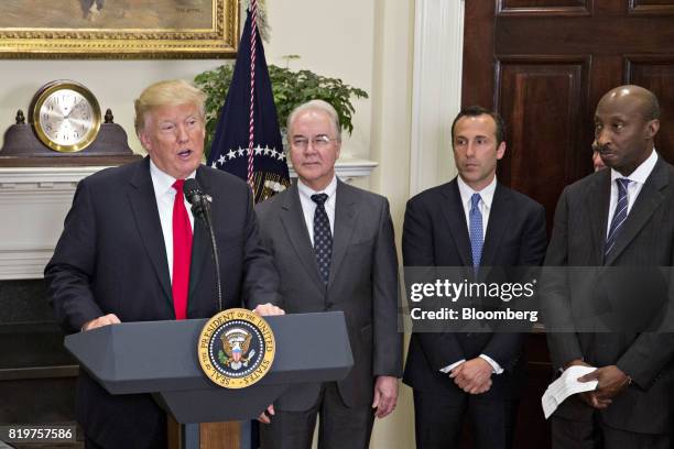 President Donald Trump, left, speaks as Tom Price, U.S. Secretary of Health and Human Services , second from left, and Ken Frazier, chairman and...