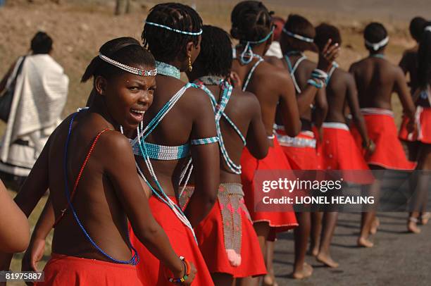 Local women in traditional Xhosa dress dance past the house of former South African President Nelson Mandela on July 18, 2008 in Qunu. Mandela is...