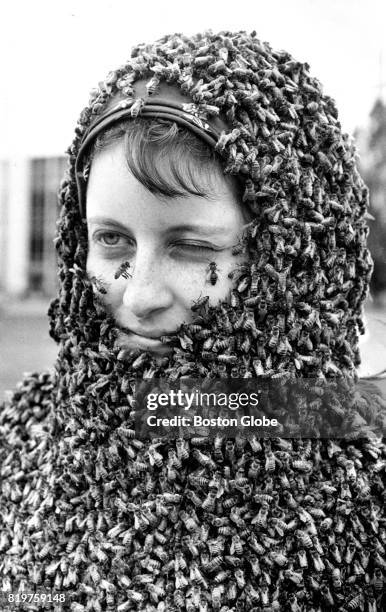 Carol Green of Bellefonte, PA wears a mantle of bees at the Easton Agricultural Society's annual conference at the University of Maine, in Orono, ME...