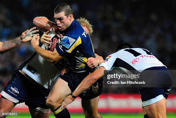 Ben Harris of the Cowboys looks to get through the Bronco defence during the round 19 NRL match between the North Queensland Cowboys and the Brisbane...