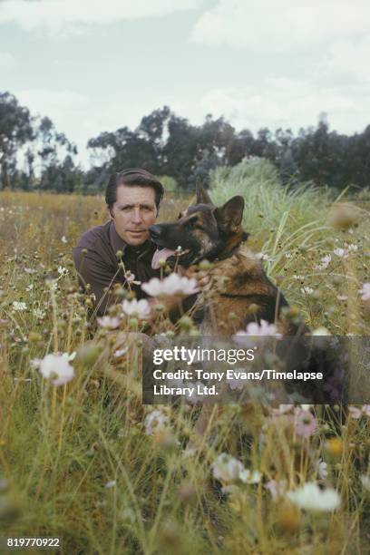 South African professional golfer Gary Player with his dog, South Africa, May 1974.