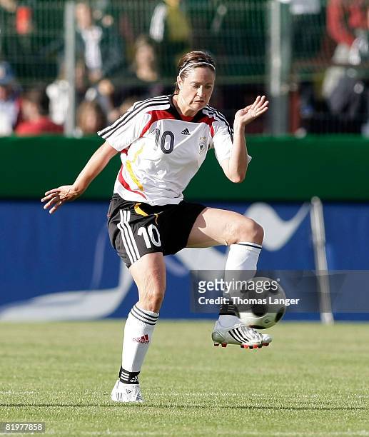 Renate Lingor of Germany controls the ball during the Women's International friendly match between Germany and England at the Generali-Sportpark on...