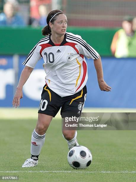 Renate Lingor of Germany running with the ball during the Women's International friendly match between Germany and England at the Generali-Sportpark...