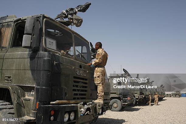 British soldiers from the 13 Air Assault Support Regiment go through the last checks on their trucks before leaving on an operation to deliver...