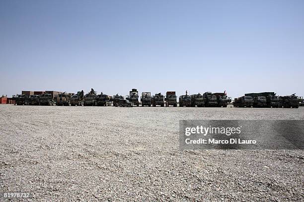 British Army trucks from the 13 Air Assault Support Regiment are prepared and wait in line to depart from their base for an operation to deliver...