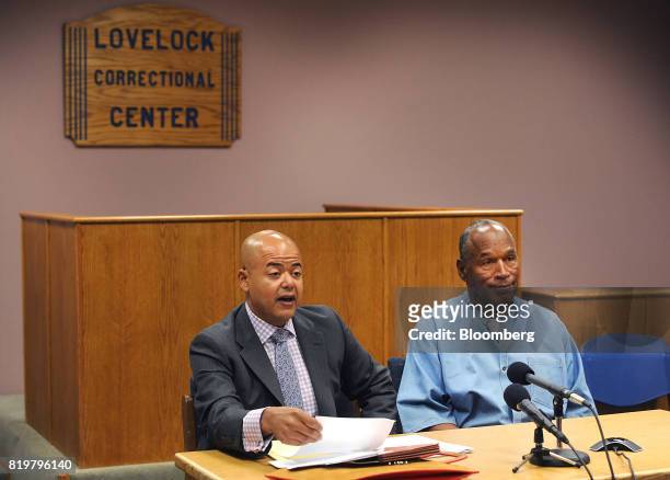 Former professional football player O.J. Simpson, right, listens during a parole hearing at Lovelock Correctional Center in Lovelock, Nevada, U.S.,...