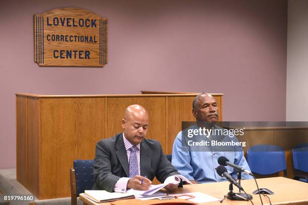 Former professional football player O.J. Simpson, right, listens during a parole hearing at Lovelock Correctional Center in Lovelock, Nevada, U.S.,...