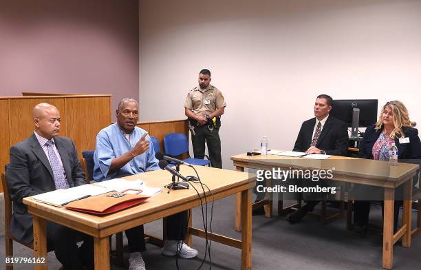 Former professional football player O.J. Simpson, second left, speaks during a parole hearing at Lovelock Correctional Center in Lovelock, Nevada,...