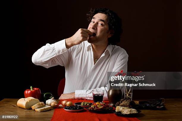 stereotypical spanish man eating tapas - arm made of vegetables stock pictures, royalty-free photos & images