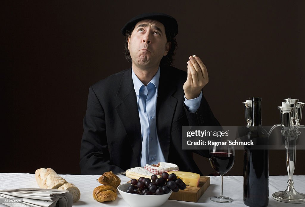 Stereotypical French man with stereotypical French food