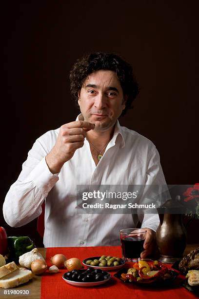 stereotypical spanish man eating tapas - arm made of vegetables stock pictures, royalty-free photos & images