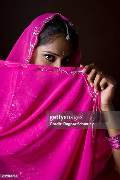 a woman dressed in traditional indian clothing - bindi stock pictures, royalty-free photos & images