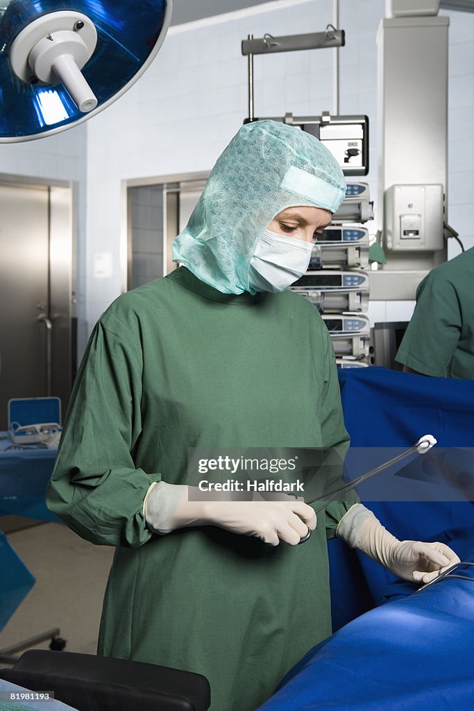 A surgeon operating on a patient