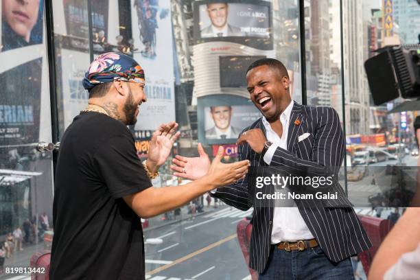 Calloway interviews singer French Montana during his visit to 'Extra' at their New York studios at H&M in Times Square on July 20, 2017 in New York...