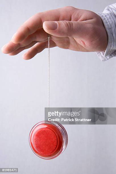 a human hand yo-yoing - yo yo stock pictures, royalty-free photos & images