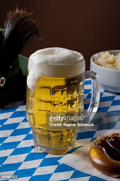 still life of a stereotypical full german beer stein - german culture stockfoto's en -beelden