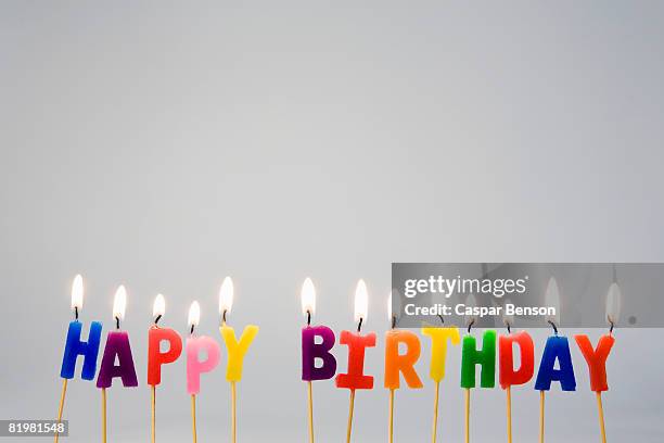 candles spelling ?happy birthday? - melted candle wax stock pictures, royalty-free photos & images